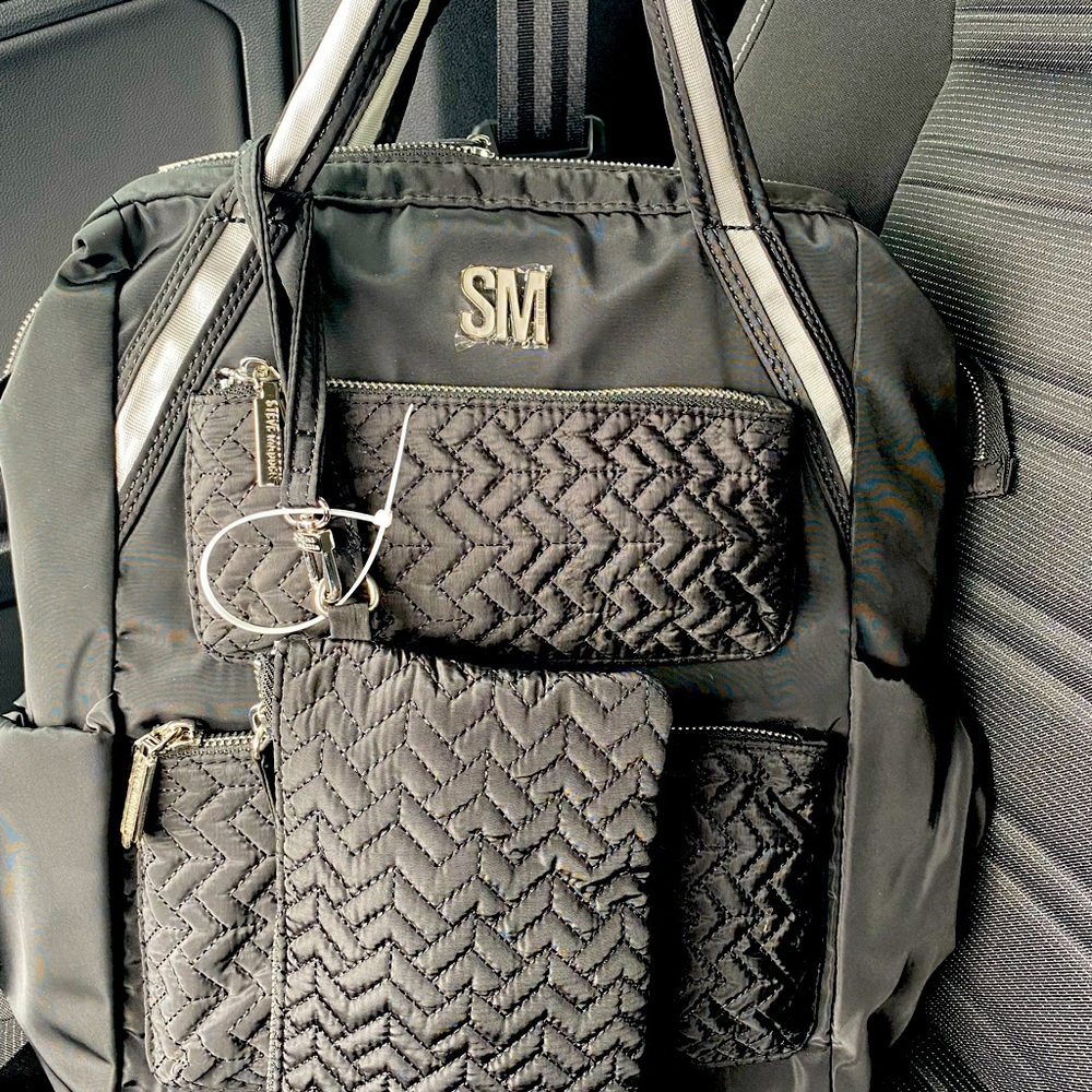 Steve Madden Backpack hard to find. Comes with accessories bag.